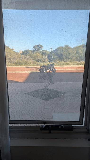 A dirty window before cleaning